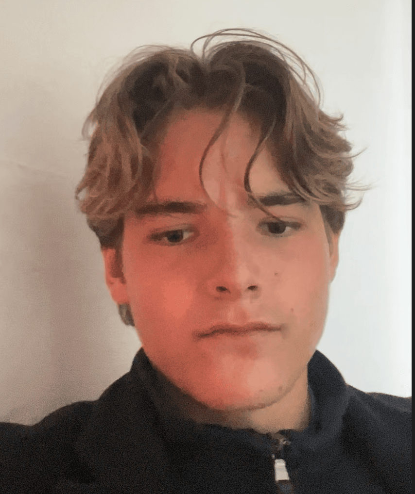 January 2025: indoor selfie against a white wall